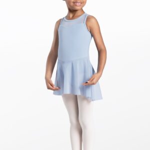 A young girl smiles with her hair in a bun, wearing the Light Blue Kids Cotton High-Low Dress, white tights, and pink ballet shoes against a plain white background.