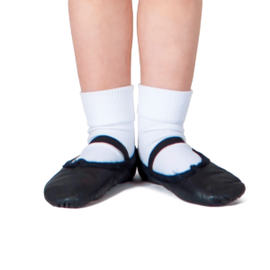 A close-up of a child's feet wearing white socks and the Sansha Star Canvas Black Ballet Shoe, standing in ballet’s first position with toes pointed outward.