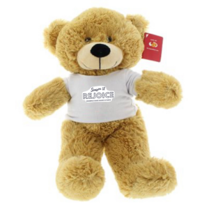 Recital Package for One Student 4 The Recital Package for Two Students includes a plush light brown teddy bear wearing a white “Rejoice” T-shirt, featuring a red tag on its ear and seated upright facing forward.