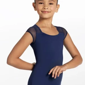 Smiling young girl with dark hair in a neat bun wears the Mesh Cap Sleeve Leotard in navy blue and light pink tights, standing in a ballet pose against a plain white background.