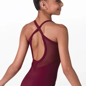 A young girl with dark hair in a bun models the Open Mesh-Back Cami Leotard, featuring crisscross straps and a mesh back, against a plain white background while smiling over her shoulder.