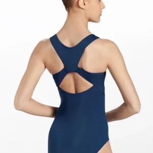 A woman with her hair in a bun stands with her back to the camera, wearing the navy blue Racerback Leotard featuring a racerback and keyhole cutout. The background is plain white.